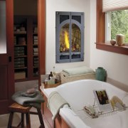 Image of bath tub which features Bed &amp; fireplace, furniture, hearth, home, home appliance, interior design, living room, table, window, wood burning stove, gray, red