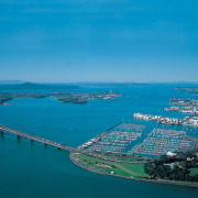 Image of the beautiful Auckland City. - Image aerial photography, artificial island, bay, bird's eye view, city, coast, coastal and oceanic landforms, fixed link, inlet, sea, sky, water, water resources, teal