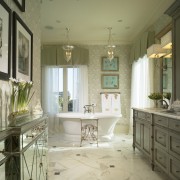 View of the bathroom which features a freestanding bathroom, ceiling, countertop, estate, floor, flooring, home, interior design, room, tile, wall, window, brown