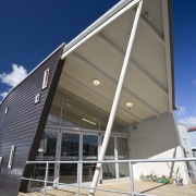 Exterior view of Clubhouse 274 which was built architecture, building, commercial building, corporate headquarters, daylighting, facade, house, roof, siding, structure, gray, blue