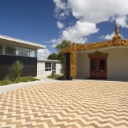 Image of Te Whanau o tupuranga school which estate, facade, floor, flooring, home, house, property, real estate, roof, sky, villa, orange