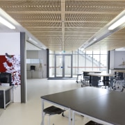 Image of Te Whanau o Tupuranga school which architecture, ceiling, daylighting, interior design, office, table, gray