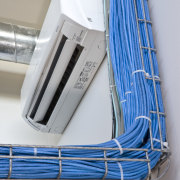 View of electrical wires and air conditioning unit. product, product design, gray