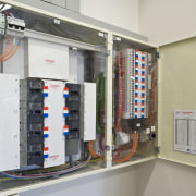 View of a power distribution board with a electrical wiring, gray
