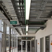 View of a hallway in the school which architecture, building, daylighting, glass, metropolitan area, gray, black