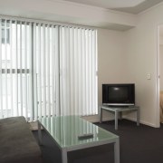 View of a lounge area in the Federal ceiling, curtain, floor, interior design, living room, real estate, room, suite, wall, window, window blind, window covering, window treatment, gray
