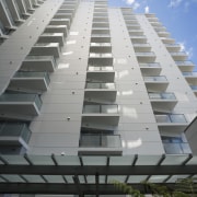 Exterior view of the Federal Apartments which feature apartment, architecture, building, commercial building, condominium, corporate headquarters, daylighting, daytime, facade, headquarters, line, metropolitan area, real estate, residential area, sky, tower block, gray