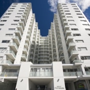 Exterior view of the Federal Apartments where Scarbro apartment, architecture, brutalist architecture, building, commercial building, condominium, corporate headquarters, daytime, elevation, facade, headquarters, hotel, metropolis, metropolitan area, mixed use, property, real estate, residential area, sky, skyscraper, tower block, white, gray