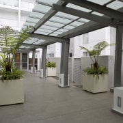 View of a two-storey maisonette which lines the courtyard, daylighting, interior design, property, real estate, roof, gray