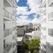 Exterior view of the Federal Apartments which where apartment, architecture, building, commercial building, condominium, corporate headquarters, daylighting, daytime, facade, headquarters, home, house, metropolitan area, mixed use, neighbourhood, real estate, residential area, sky, suburb, tower block, urban area, urban design, gray, white