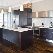 View of a renovated kitchen with granite benchtops, cabinetry, countertop, cuisine classique, floor, flooring, hardwood, interior design, kitchen, real estate, room, wood, wood flooring, white