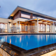 Exterior view of an energy-efficient home which was apartment, architecture, estate, facade, home, house, property, real estate, swimming pool, villa, window, teal