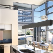 View of kitchen area a long kitchen island, countertop, daylighting, interior design, kitchen, window, white, gray