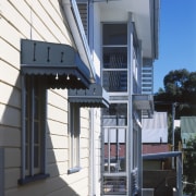 Exterior view of this renovated Brisbane home which house, siding, structure, black