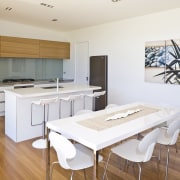 View of the kitchen with oak veneer cabinetry, countertop, floor, flooring, hardwood, interior design, kitchen, real estate, room, wood flooring, white