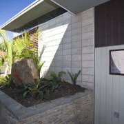 View of the exterior of this holiday home architecture, cottage, facade, home, house, property, real estate, siding, window, gray, black