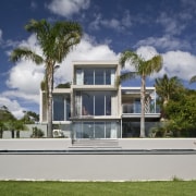 Exterior view of the rear of the renovated architecture, arecales, building, cottage, elevation, estate, facade, home, house, mansion, official residence, palm tree, property, real estate, residential area, sky, villa, gray, blue