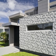 Exterior view of the front entrance with landscaping, architecture, building, daylighting, elevation, estate, facade, home, house, property, real estate, residential area, roof, siding, sky, wall, window, gray