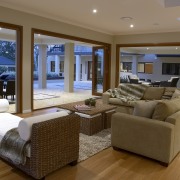 View of a living area of a home estate, floor, flooring, hardwood, home, interior design, living room, penthouse apartment, property, real estate, room, wall, window, wood, wood flooring, brown