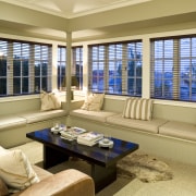 View of a living area, couches, coffee table, estate, home, interior design, living room, real estate, room, window, window blind, window covering, window treatment, orange, brown