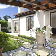 View of the patio area in the Mediterranean-style home, interior design, patio, property, real estate, white