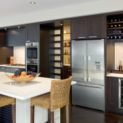 View of contemporary home with light-toned and beige cabinetry, countertop, home appliance, interior design, kitchen, gray, black