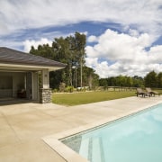 Image of coloured concrete from Peter Fell Ltd backyard, estate, home, house, landscape, property, real estate, residential area, sky, swimming pool, villa