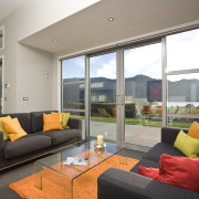 View of an open-plan living area inside a architecture, house, interior design, living room, property, real estate, window, gray