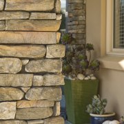 Image of this new home in central Otago stone wall, wall, window, wood, brown, orange