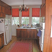 View of kitchen before the renovations. - View cabinetry, countertop, floor, flooring, hardwood, home, house, interior design, kitchen, property, real estate, room, wall, window, wood, red, gray