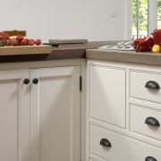 View of kitchen with white painted maple cabinetry, cabinetry, chest of drawers, countertop, drawer, furniture, home appliance, kitchen, room, gray
