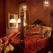 View of a bedroom with a Victorian-styled four-post bed, bedroom, furniture, home, interior design, lighting, room, suite, textile, window, red