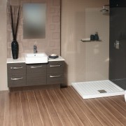 View of a bathroom which features solid-surface countertops bathroom, bathroom accessory, bathroom cabinet, floor, flooring, hardwood, interior design, laminate flooring, plumbing fixture, product design, room, sink, tile, wood, wood flooring, gray