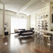 View of open-plan living and kitchen area with ceiling, floor, flooring, hardwood, interior design, laminate flooring, living room, loft, real estate, wood, wood flooring, white, brown