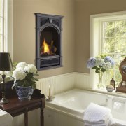 View of a portrait-styled fireplace by Fireplace Xtrordinair. fireplace, hearth, home, interior design, living room, room, window, yellow