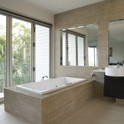 View of a bathroom which features Scyon Secura bathroom, bathtub, floor, flooring, home, interior design, room, tile, wall, window, gray