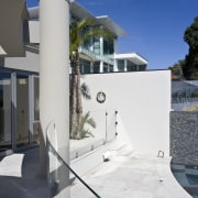 View of a curved glass balustrade from Glasshape. architecture, house, property, sky, wall, white