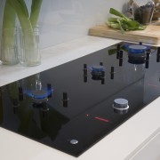 View of a kitchen which features a Fisher countertop, furniture, glass, product design, table, white, gray, black