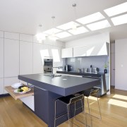 The new Poggenpohl Plus Modo kitchen contrasts light countertop, floor, interior design, kitchen, product design, table, wood flooring, white