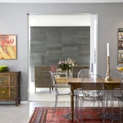 View of the dining area which features an chair, dining room, floor, flooring, furniture, home, interior design, living room, table, gray, white