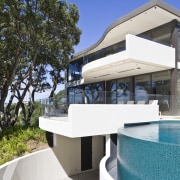 Exterior view of A Waterside house made of architecture, estate, home, house, property, real estate, swimming pool, villa, white