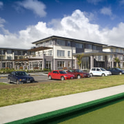 Exterior view of Summerset by the Park retirement apartment, building, corporate headquarters, estate, family car, home, house, luxury vehicle, mixed use, neighbourhood, property, real estate, residential area, suburb, white