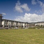 Exterior view of the Summerset by the Park apartment, building, cloud, condominium, corporate headquarters, estate, grass, home, house, land lot, property, real estate, residential area, sky, brown