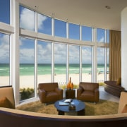 View of living area with sofas and leather condominium, daylighting, interior design, living room, penthouse apartment, real estate, window, gray, brown