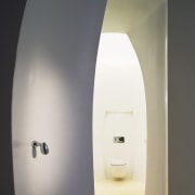 View of a powder room with an egg-shape light fixture, lighting, product design, gray, white