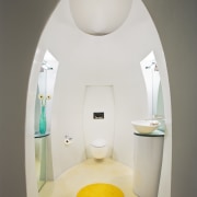 View of a powder room with an egg-shape bathroom, interior design, lighting, plumbing fixture, product design, room, tap, toilet, toilet seat, white, gray