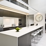View of kitchen featuring large island, dark-stained oak countertop, interior design, kitchen, real estate, white
