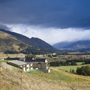 Exterior view of this holiday home which features alps, cloud, cottage, farm, fell, field, grass, grassland, highland, hill, hill station, home, house, landscape, meadow, meteorological phenomenon, mount scenery, mountain, mountain range, mountainous landforms, plateau, real estate, ridge, rural area, sky, tree, valley, village, winter, blue