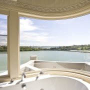 View of a curved bathroom window which was apartment, architecture, daylighting, estate, interior design, property, real estate, sky, water, window, white