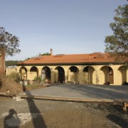 Exterior view of house prior to renovations where estate, facade, hacienda, historic site, home, house, property, real estate, villa, brown